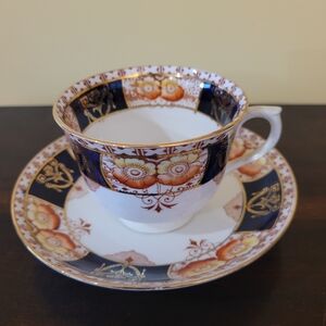 Porcelain Teacup and Saucer with Navy, Orange and Gold Floral Motif